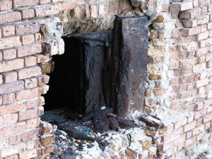 Figure 6: Corrosion of the embedded iron Totten shutters has severely damaged the masonry surrounding the embrasure openings.