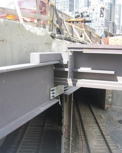 Careful detailing at the train tunnel was required to isolate members supporting the precast tunnel enclosure from the main building structure.