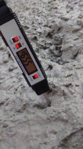 Calibrated thermometer checking the temperature of in situ concrete.