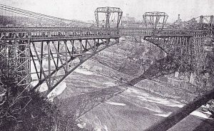 Erection under Roebling Suspension Bridge.