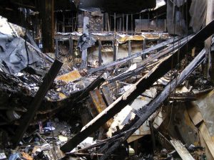 Figure 1. Debris field – roof charred joists cover collapsed first floor.