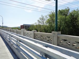 A new crashworthy barrier at the curb allows for reticulated balustrades and sidewalks narrowed from 11 feet to 7 feet to allow for adequate geometrics for bridge inspections.