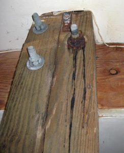 Figure 3. Corrosion of bolt due to wicking at the top of an interior pile under a coastal home.