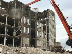 Figure 19. A progressive collapse to the ground floor began on the 4th floor as a result of overloading the floor framing with an excessively large debris pile.