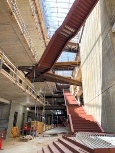 Steel framing provides the structure for the ornamental stairs and bridges that span across the skylit central atrium.
