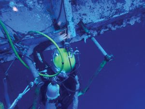 Figure 1. Welder diver performs underwater wet welding.