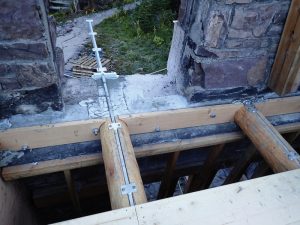 Figure 9. Second-floor balcony joist flitch grouted in wall pocket. Joists are supported on inside face of wall by a steel angle ledger.