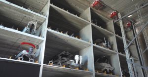 In an automated dry boat storage facility, the structural design must consider the additional weight of fire suppression water, which may collect in the stored boats in the event of a fire.