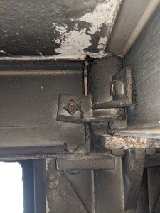 Figure 13. Cracked beam-web connection clip at a penthouse cast-iron column.