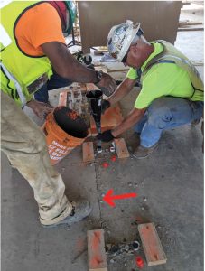 Figure 3. The PS=Ø mechanical coupler allows for a gapless pour strip and is grouted with a high-strength, non-shrink grout after the EOR specified time; the red arrows indicate the open joint that will be filled with the same non-shrink grout.