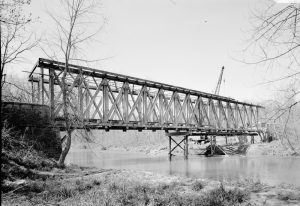 The Truss of the 1840 Long “Wagon” Covered Bridge over the East Fork of the Whitewater River, Brownsville, Indiana. The only remaining Long Truss Bridge in Indiana. Dismantled and relocated to Indianapolis, Indiana, in 1974. Courtesy of the Library of Congress.