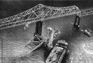 Ship and bridge after the collapse; rammed pier center-right.
