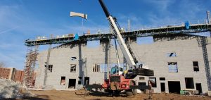 Figure 3. Precast concrete arch being installed on 16-inch CMU wall.