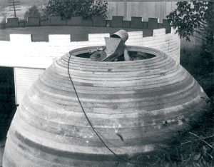 Figure 5. A domed structure is being constructed by one person and a Wall Building Machine, a feat yet to be accomplished with a modern printing system at this scale. Note the decreasing layer height as slope increases, a technique now used in modern 3-D printing systems to manage overhanging layers. Courtesy of David Tippold – Urschel Laboratories, Inc.