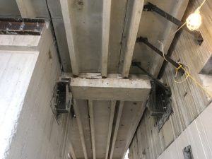 Figure 1. Concrete girders “released” from supporting wall with epoxied support brackets.