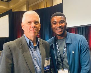 Mentoring pair Frank Agnew and first-time student scholarship attendee Alex Adediran at ETS Conference.